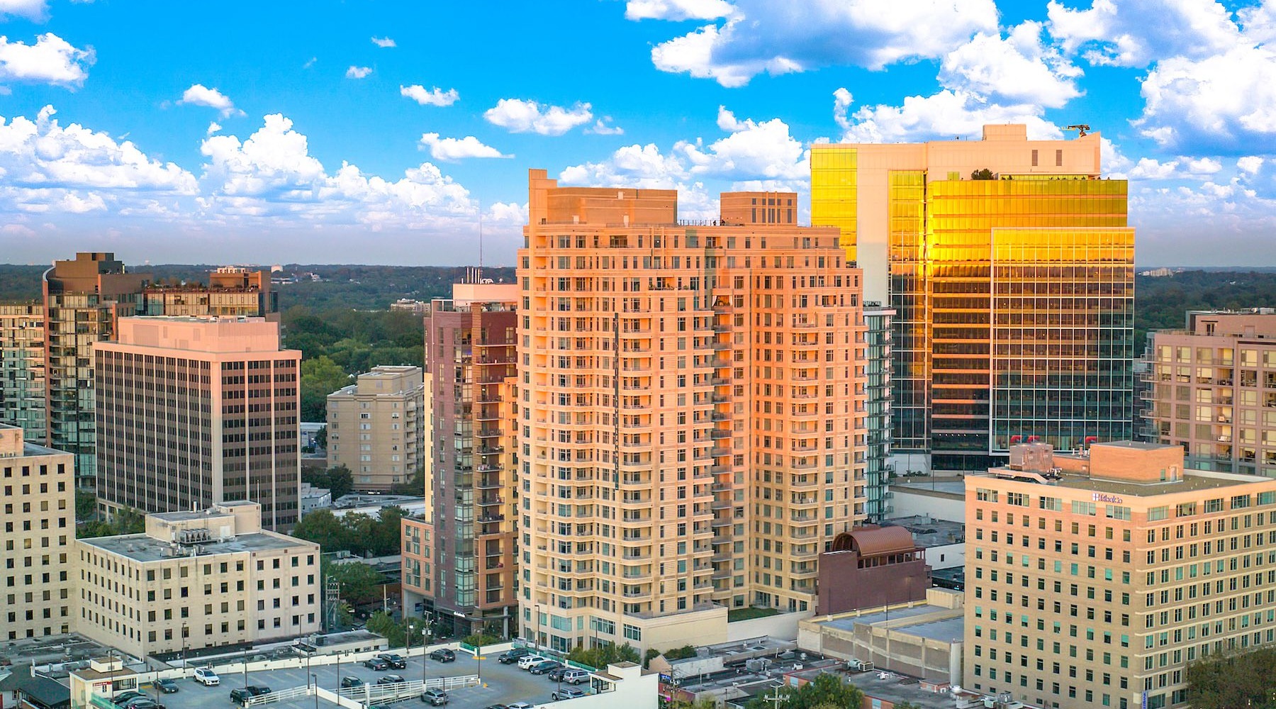 The exterior of Sophia Bethesda Apartments in Bethesda, MD, featuring a modern facade with an orange exterior.